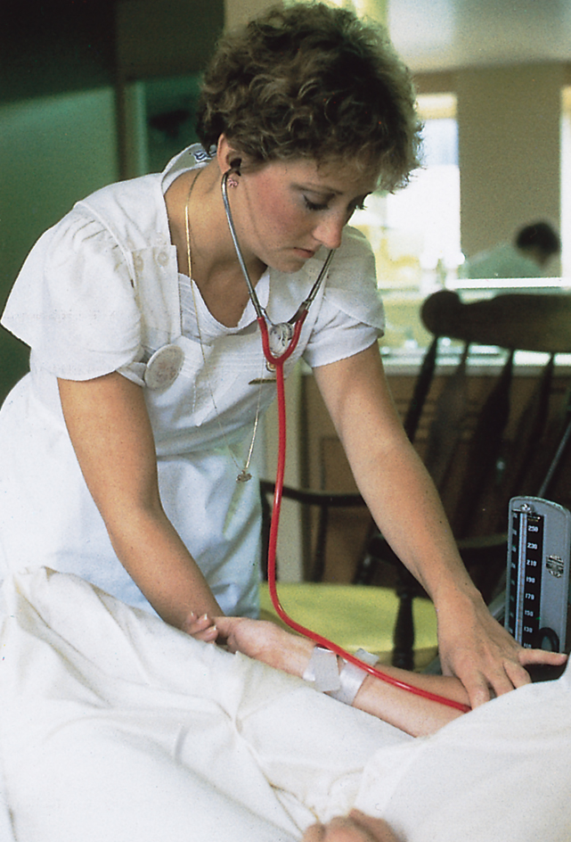 Nurse taking a patient's blood pressure