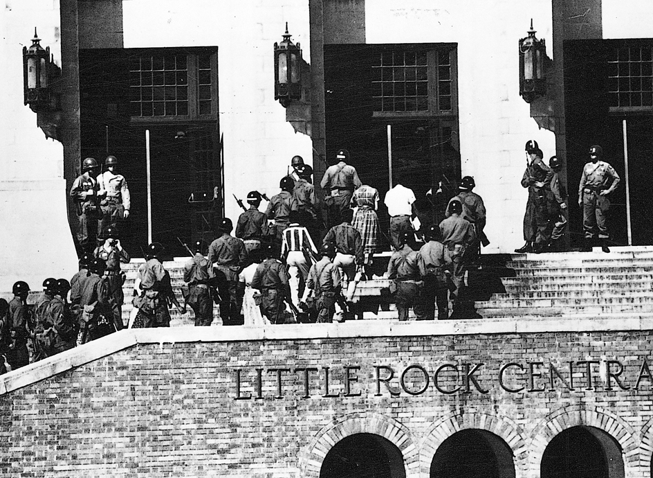 Troops escort Black students into school