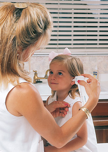 Checking for fever with a thermometer