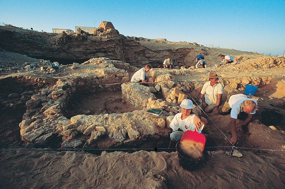 Archaeologists excavate ruins of an ancient city