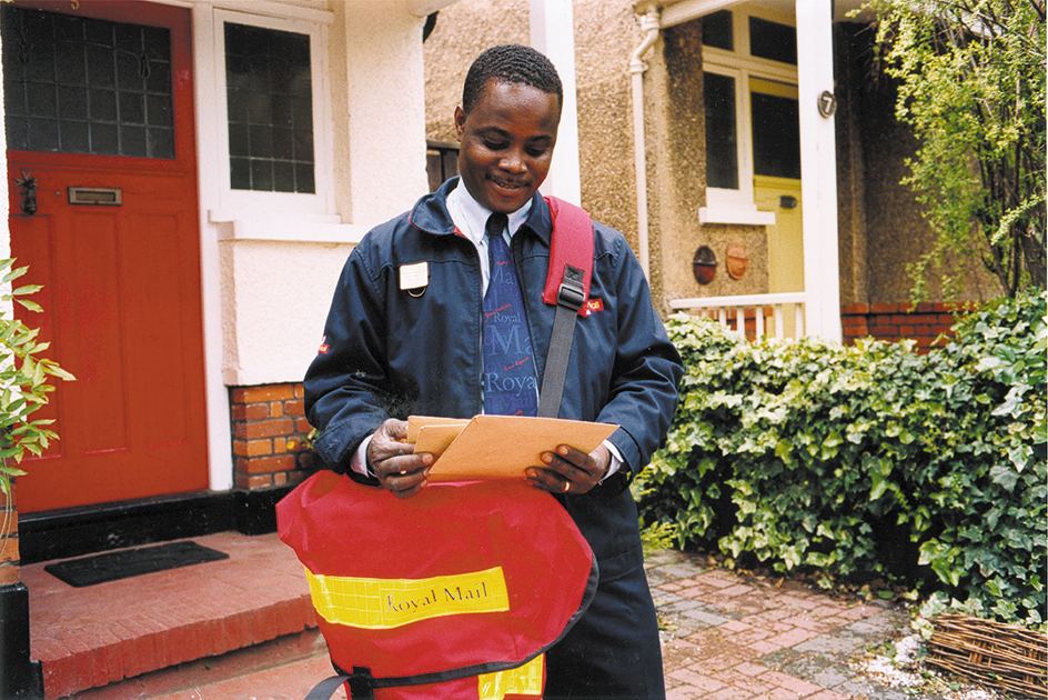 Letter carrier delivering mail