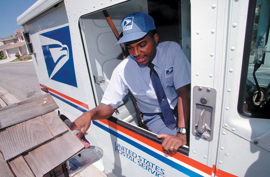 U.S. postal worker delivering mail