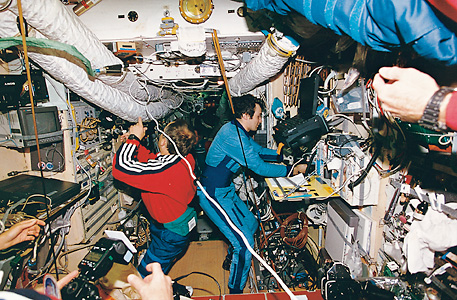 Cosmonauts exchange information aboard Mir