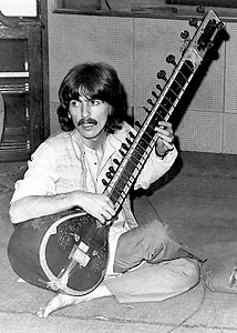 George Harrison plays the sitar in India