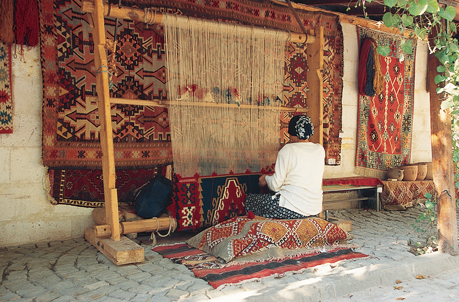 Turkish weaver creates an Oriental rug