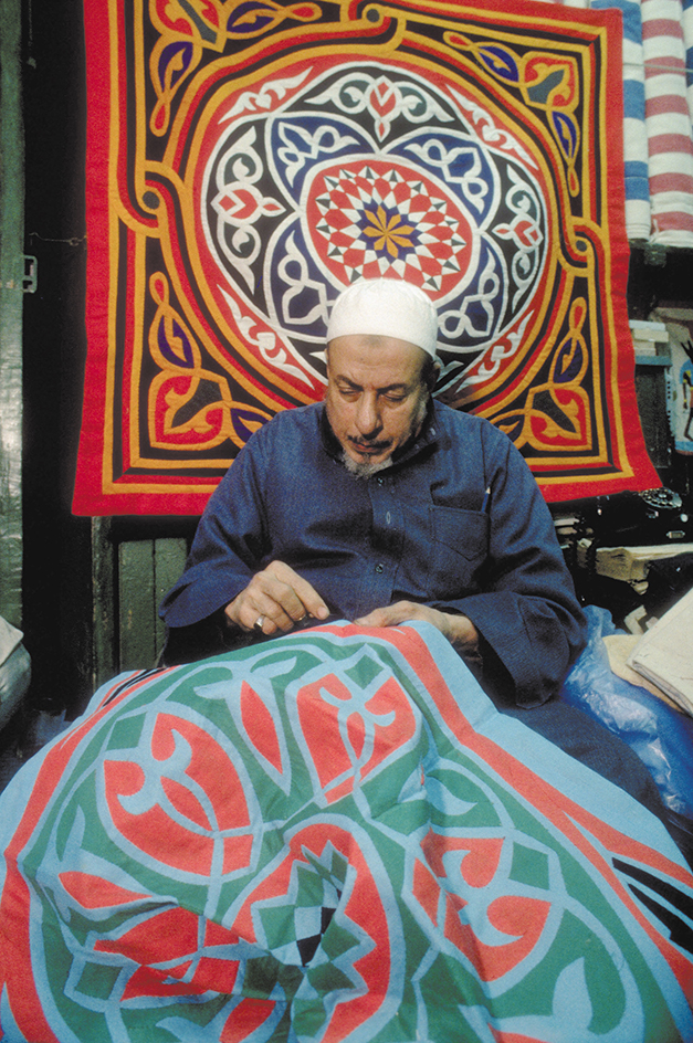 Artist working on applique