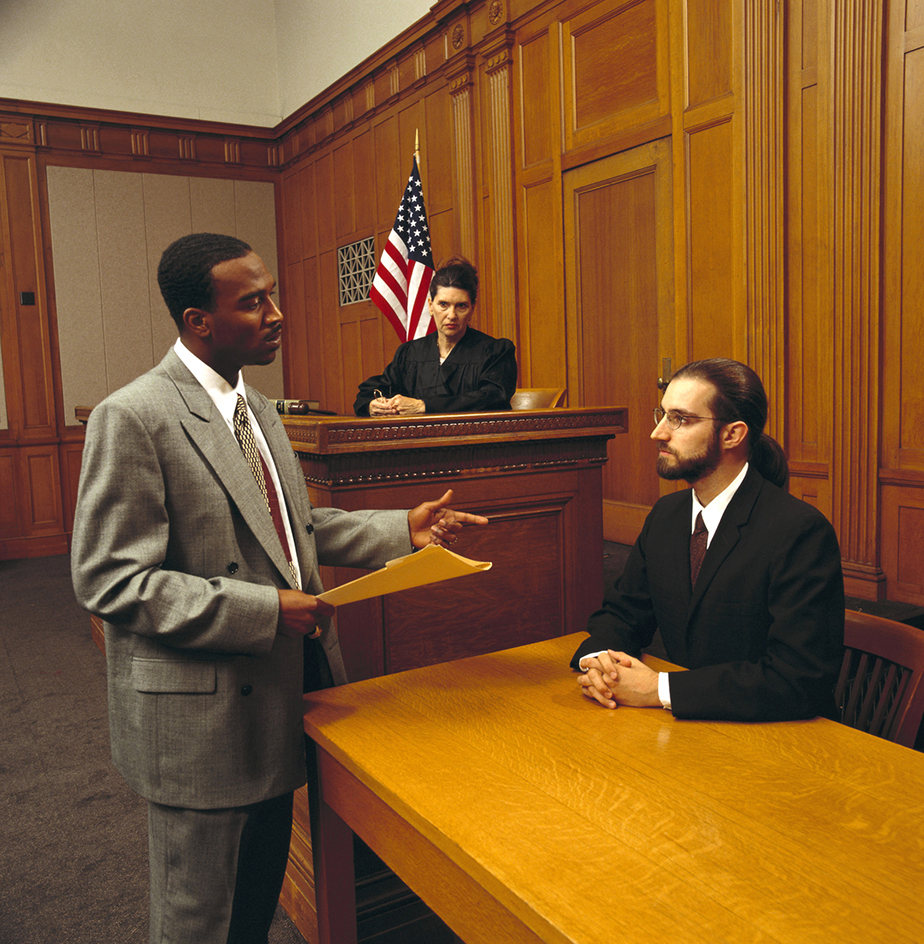 A witness testifies in a courtroom