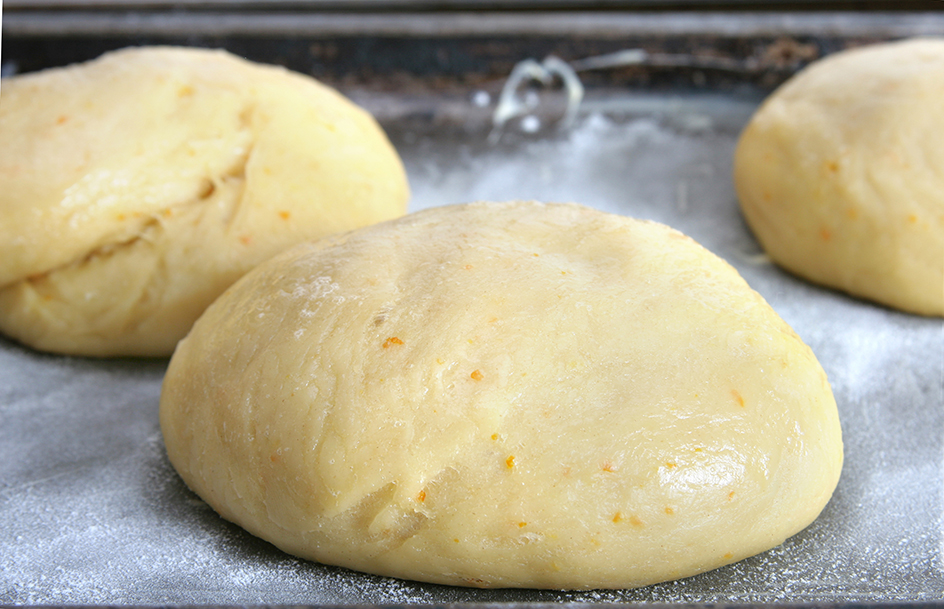 Yeast grows in bread dough and makes it puff up