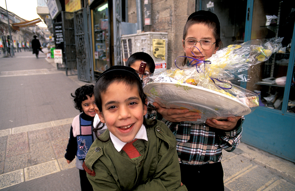 People celebrate Purim by giving food to their neighbors