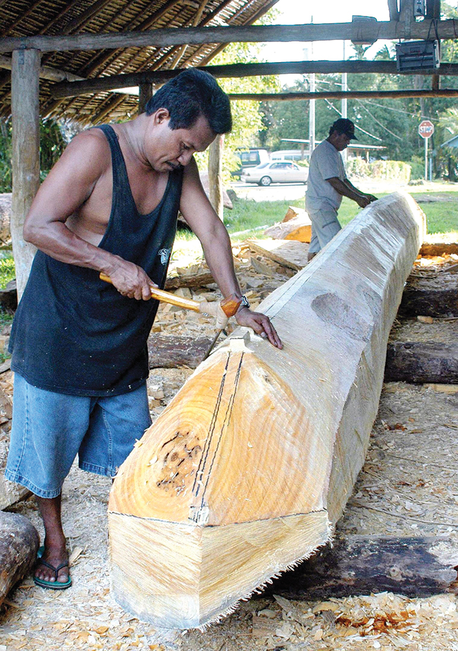 Carving a canoe on Palau Island