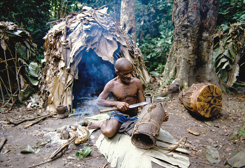 A Mbuti man making a vessel