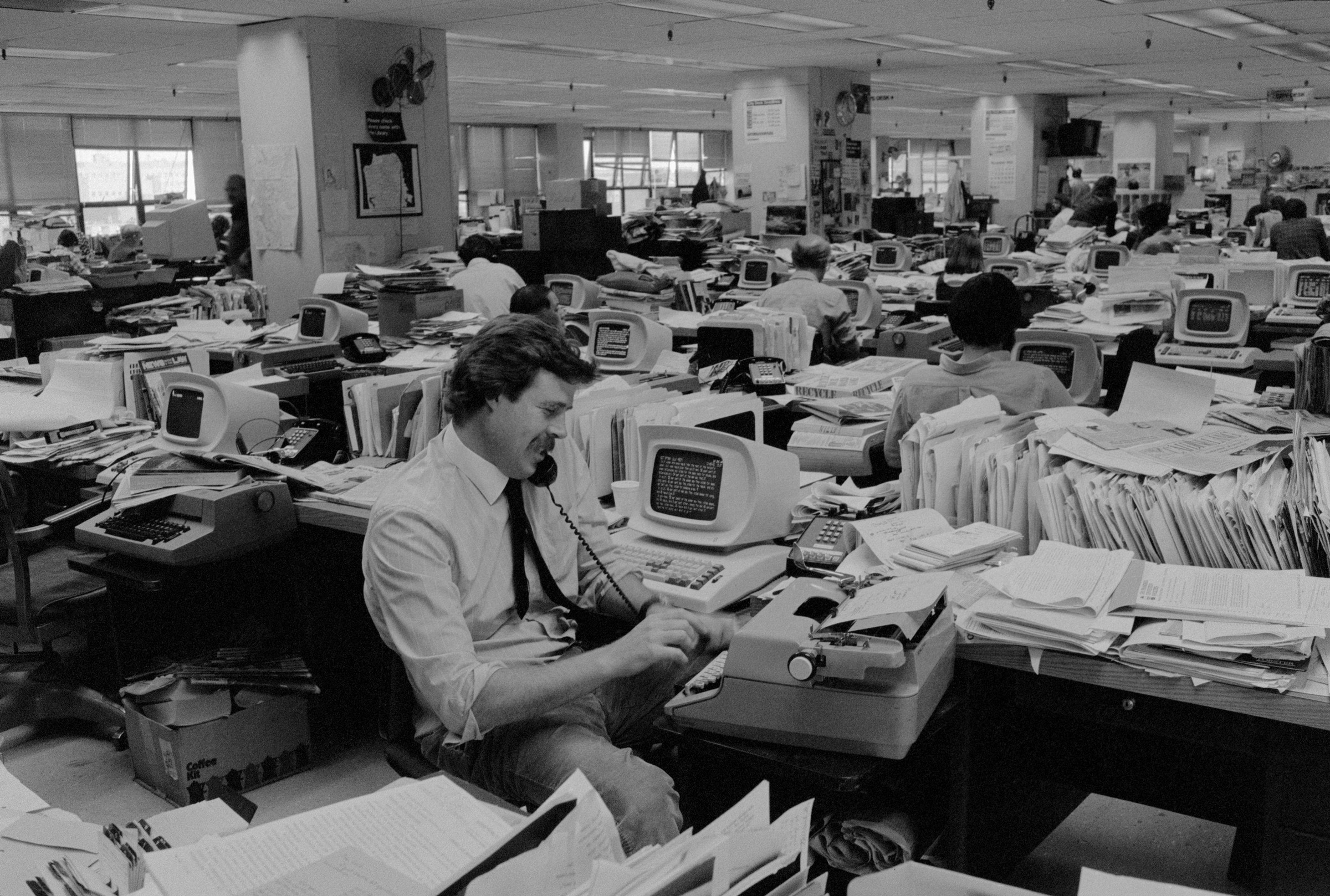 Writers in a newsroom in 1982