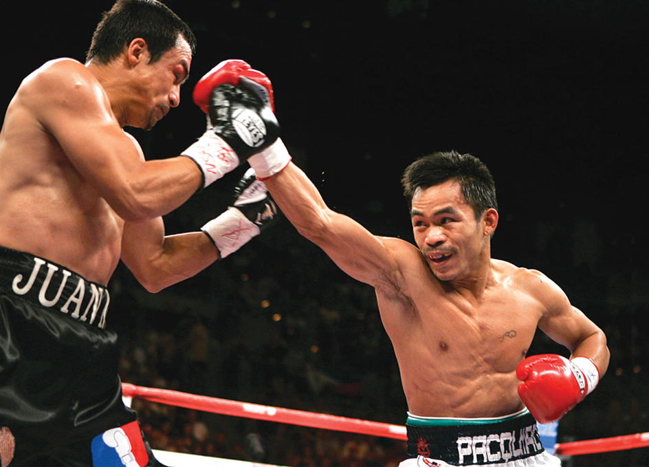 Manny Pacquiao defeats Juan Manuel Márquez