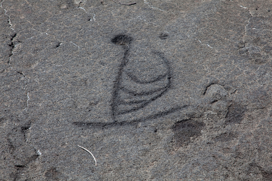 Ancient rock drawing of a Lapita canoe