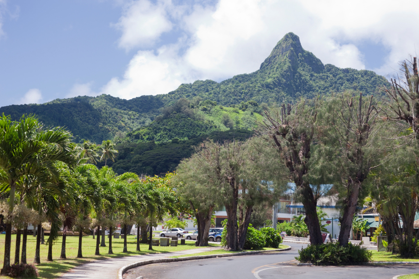 Volcanic mountains tower over Avarua, the capital of the Cook Islands.