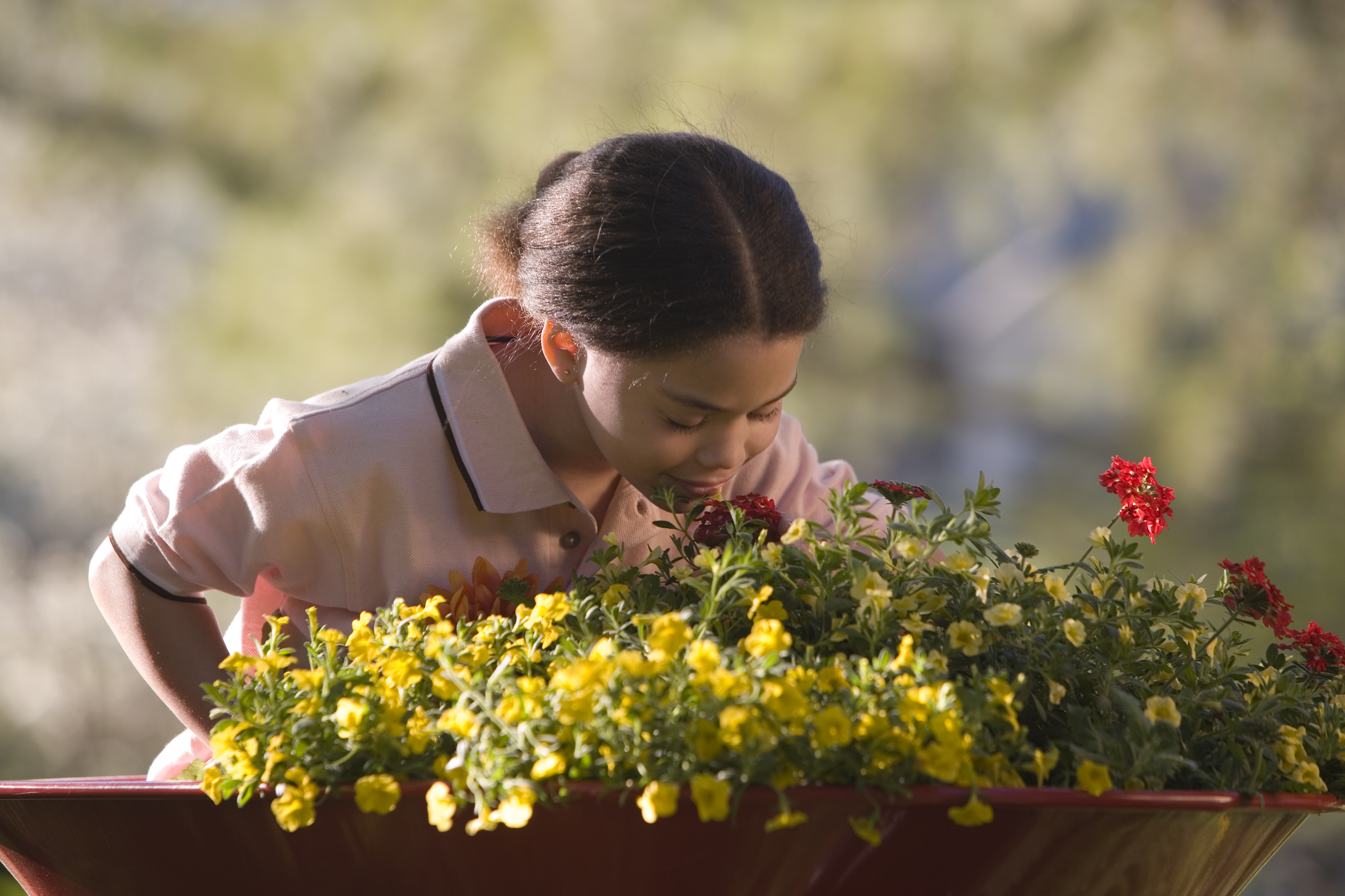 Girl smelling flowers