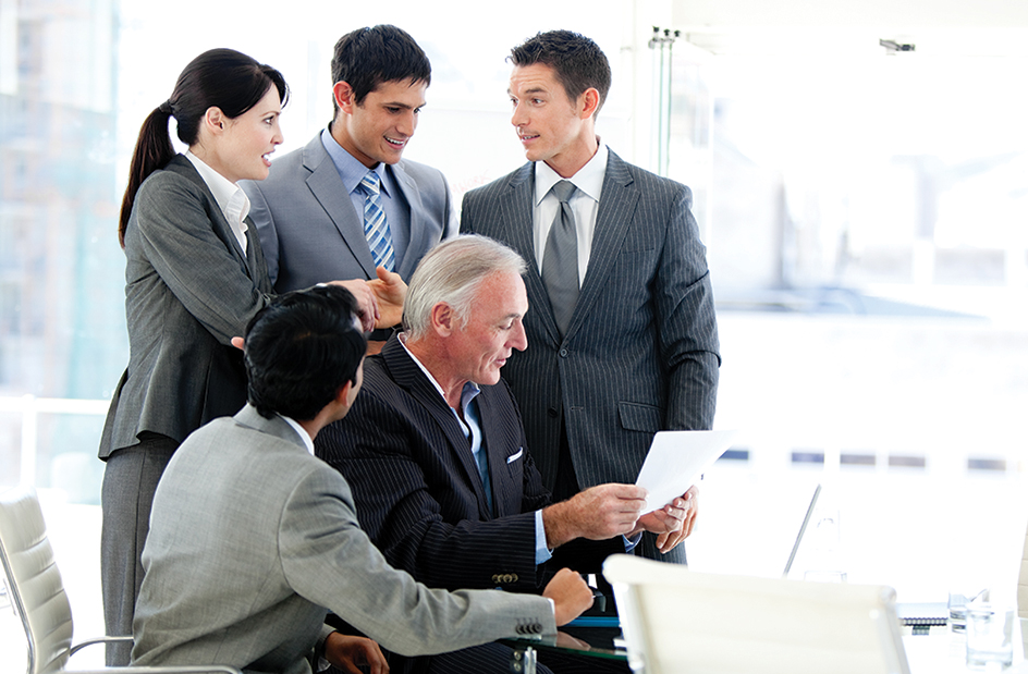 Workers in traditional business clothing