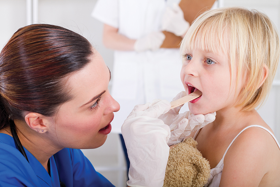 Pediatrician examining a child