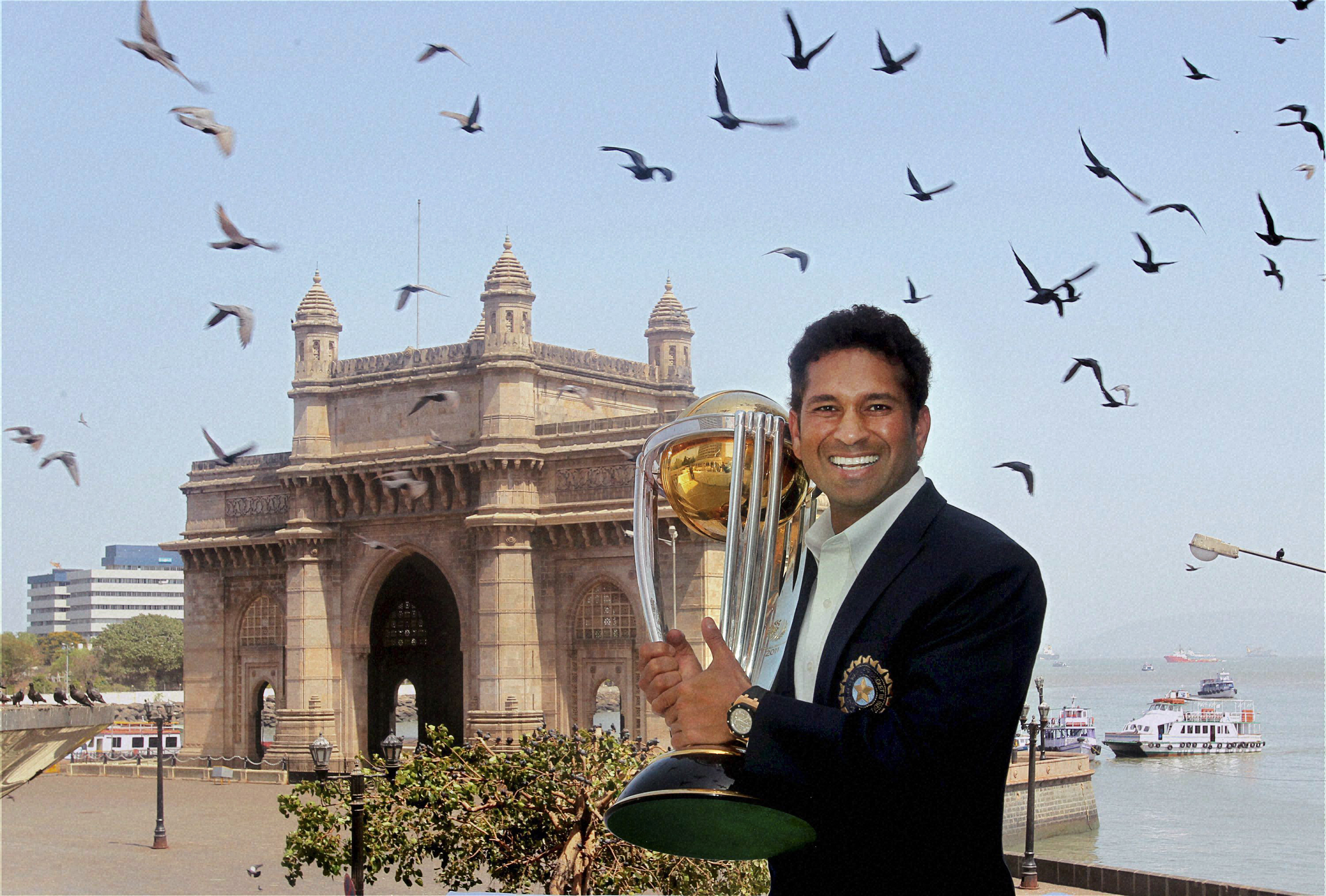 Indian cricket star Sachin Tendulkar holding the trophy for the 2011 Cricket World Cup