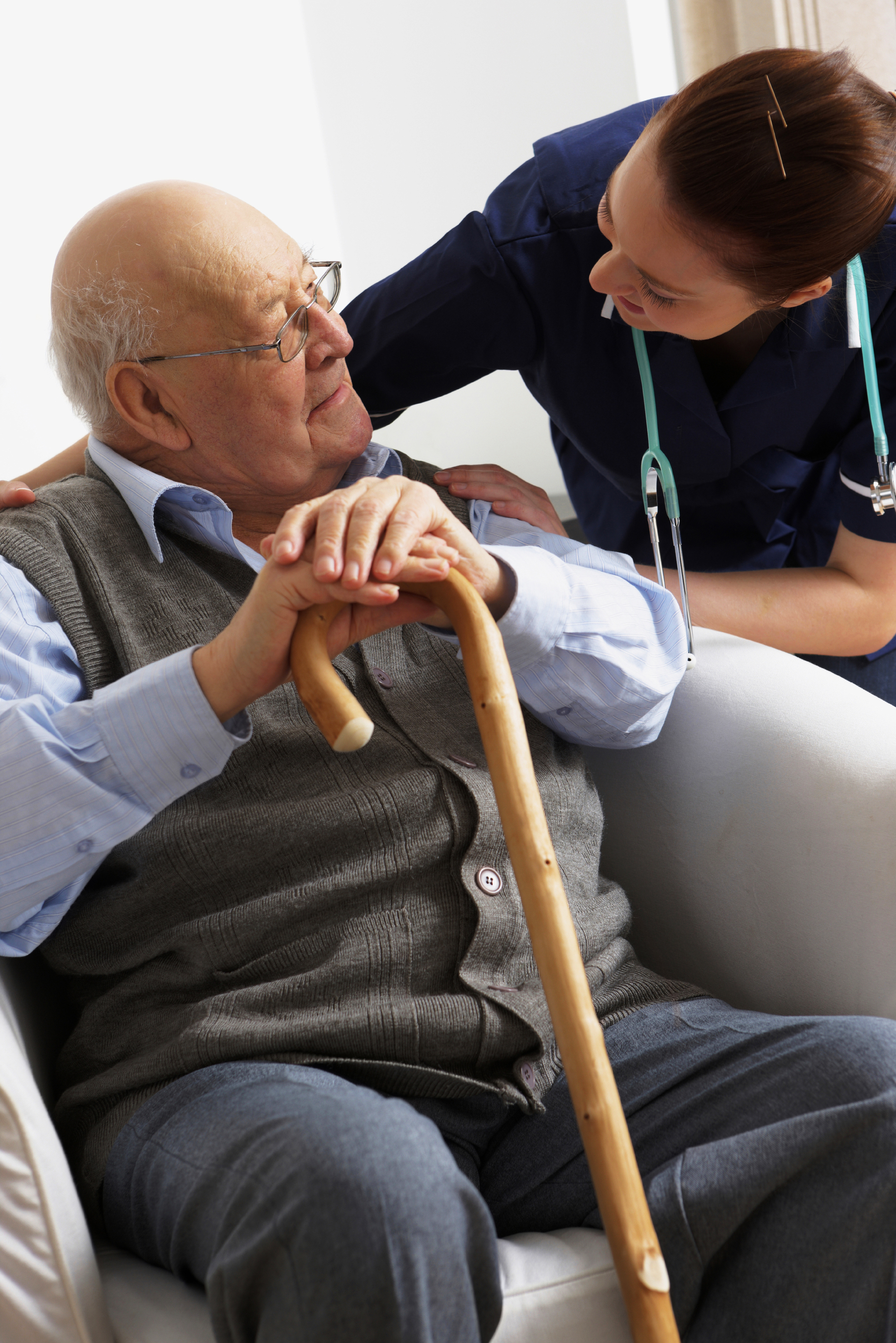 Geriatric nurse visiting with a senior citizen