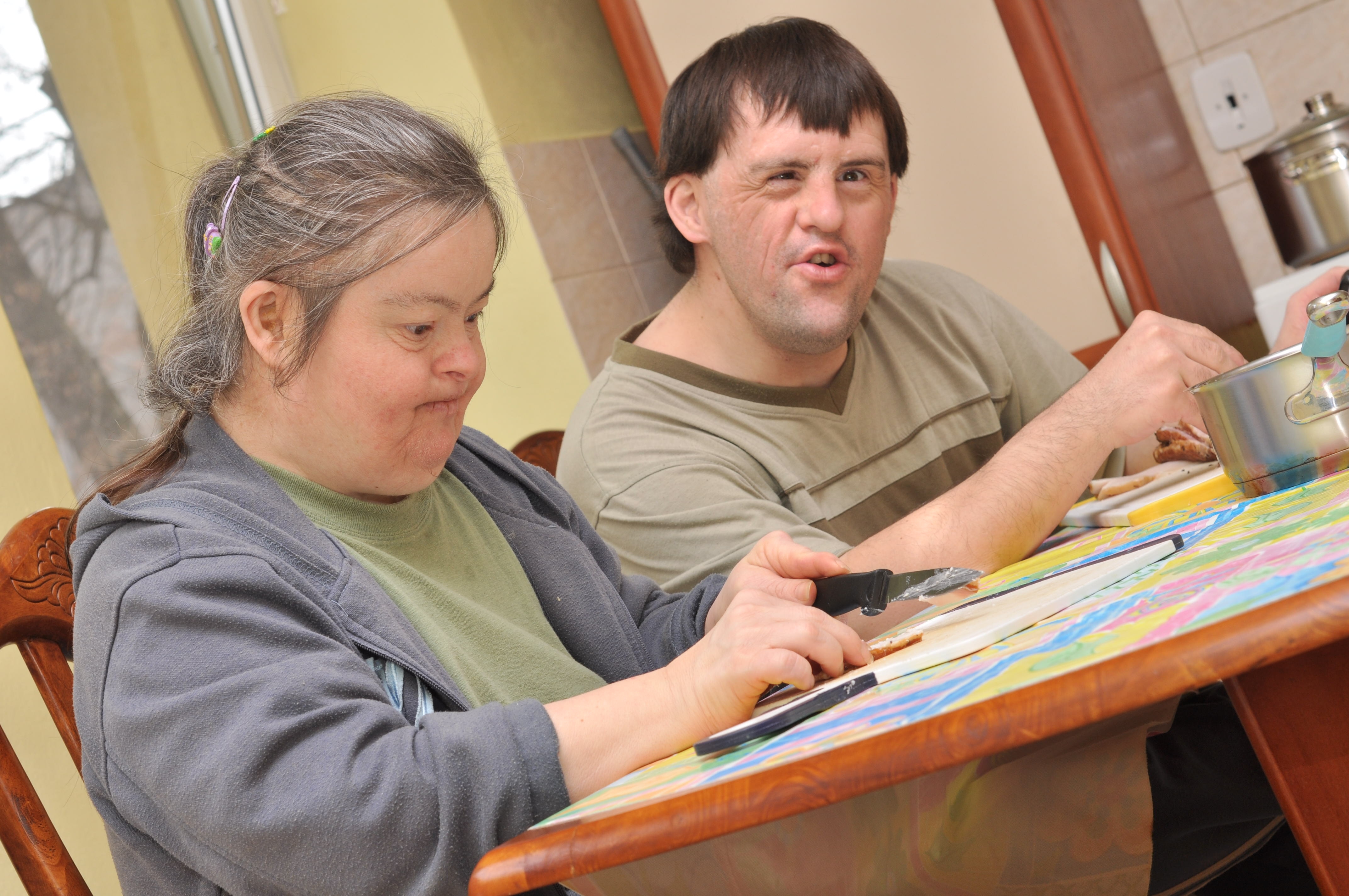 Two people with Down syndrome, a cause of intellectual disability, in a special education class