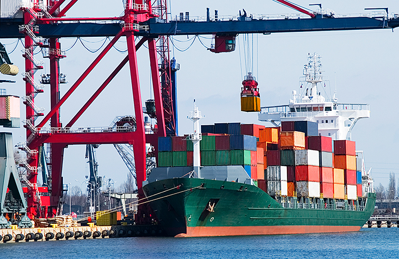 Crane loading a container ship