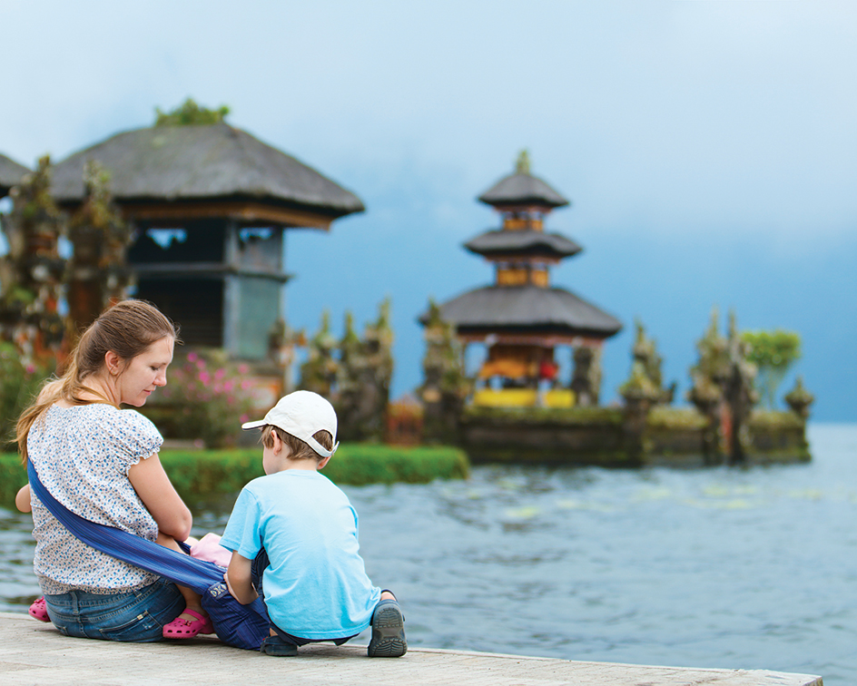 Family visiting a temple in Bali