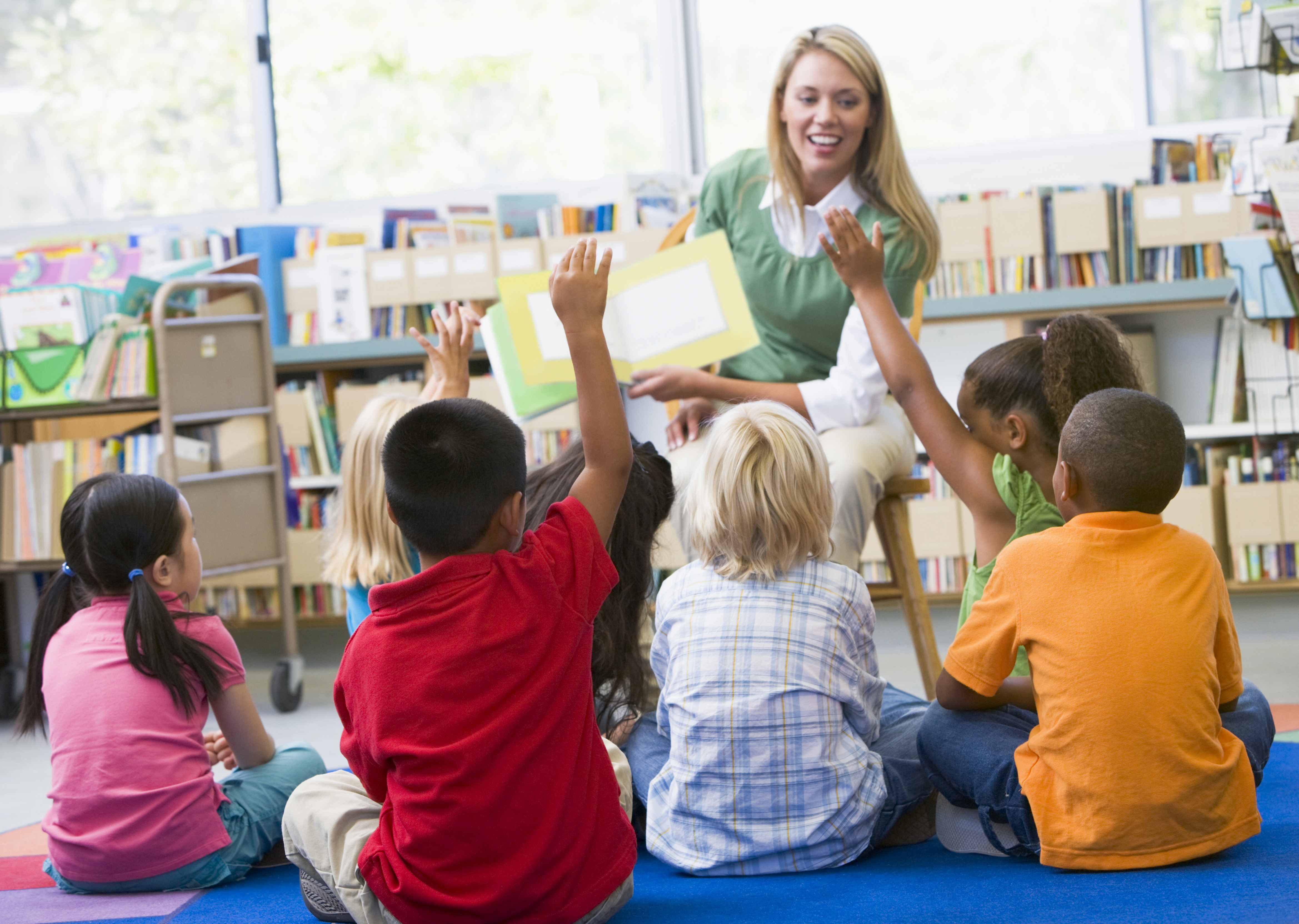 Kindergarten class reads a book