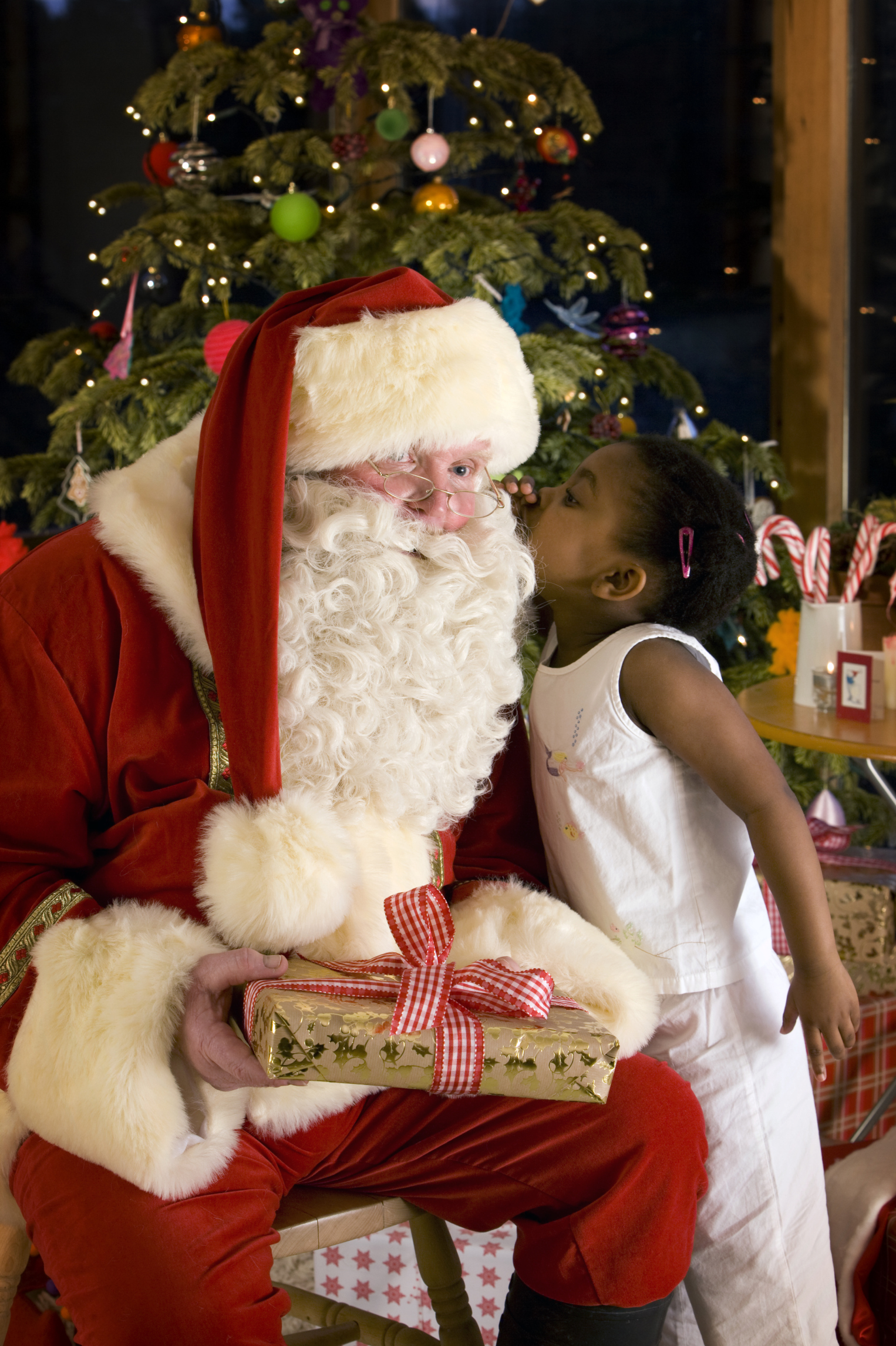 Girl visiting with Santa Claus