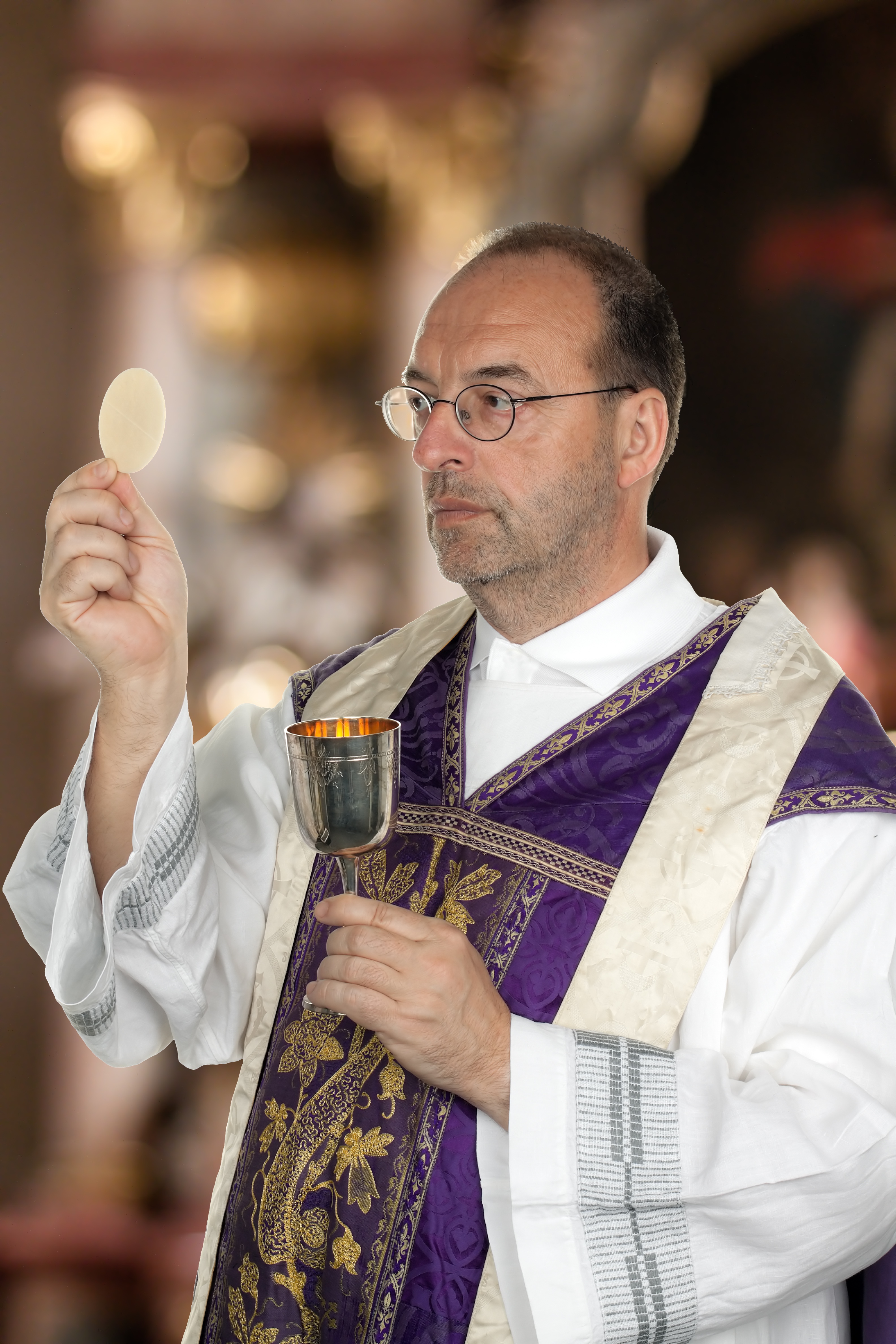 Catholic priest leading the celebration of the Eucharist, or Mass