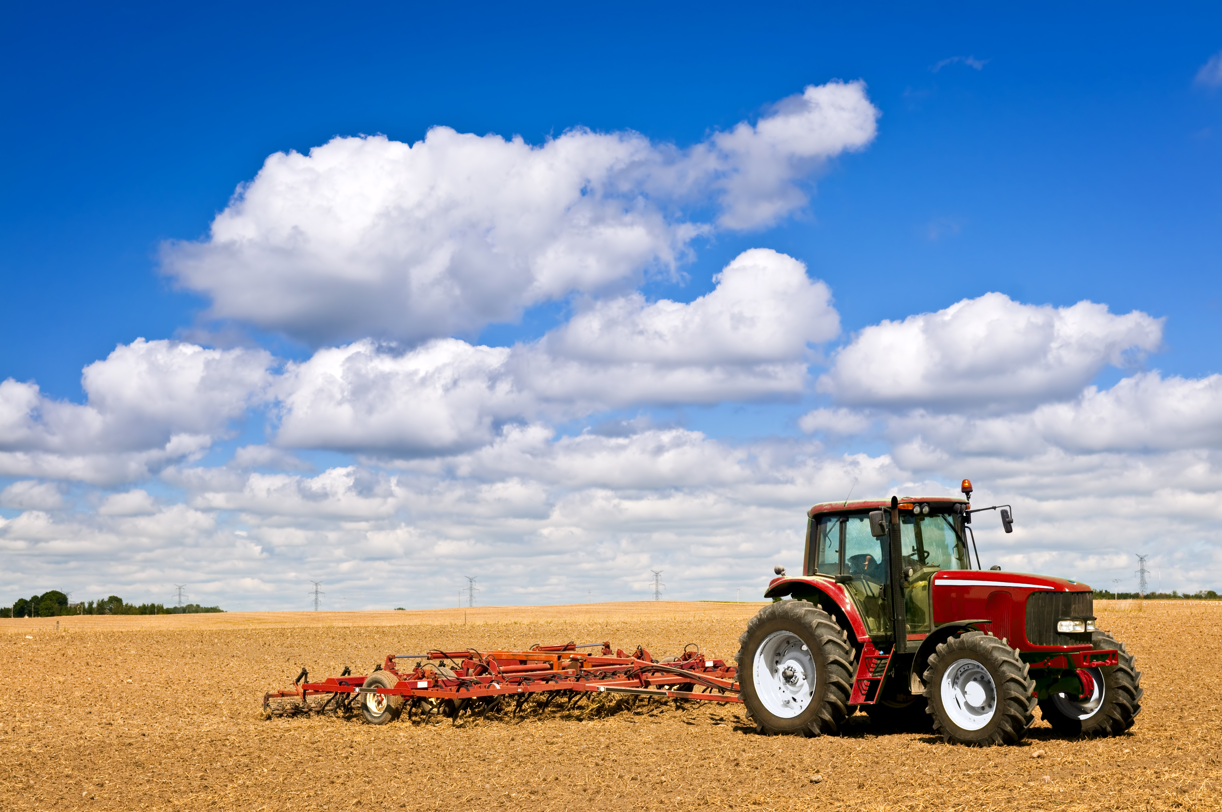 Tractor pulling a chisel plow, used in conservation tillage