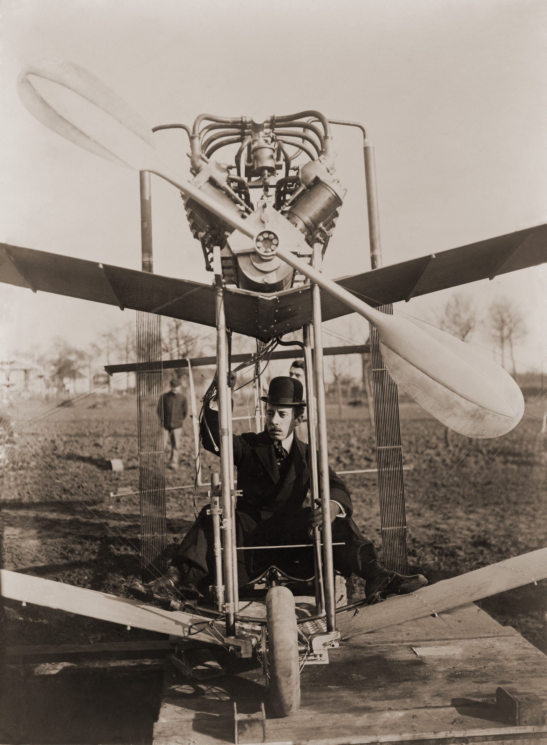 Alberto Santos-Dumont at the controls of an airplane in 1907