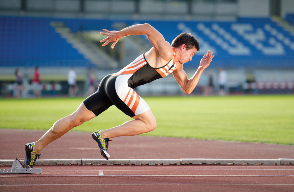 A sprinter bursts from the starting blocks