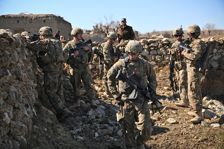 American troops patrol an Afghan village