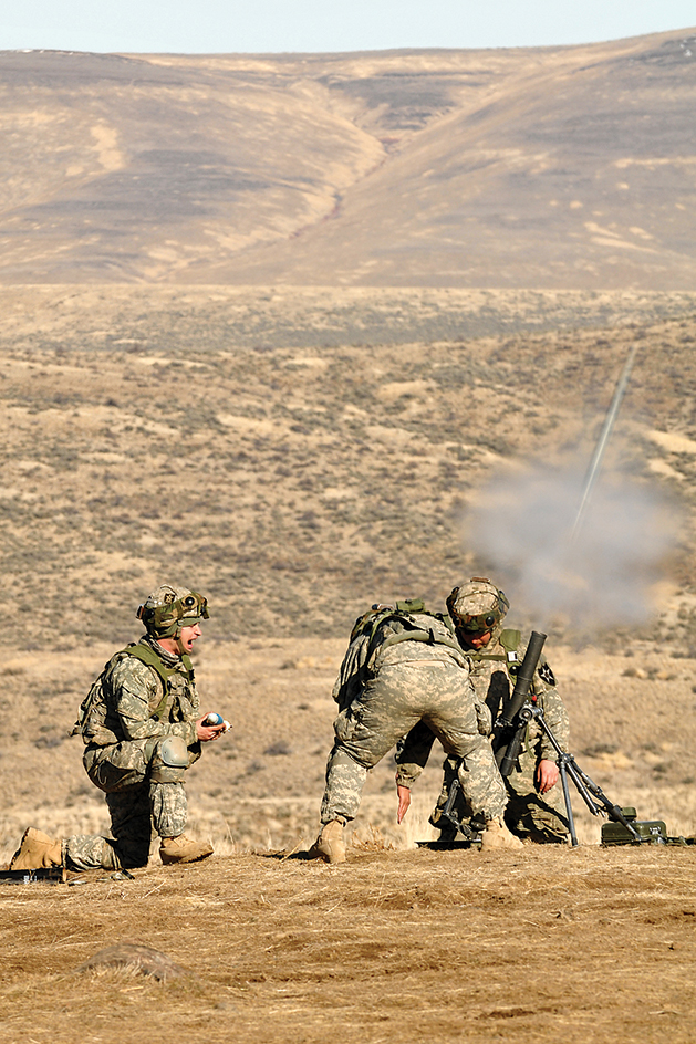 Soldiers firing a mortar