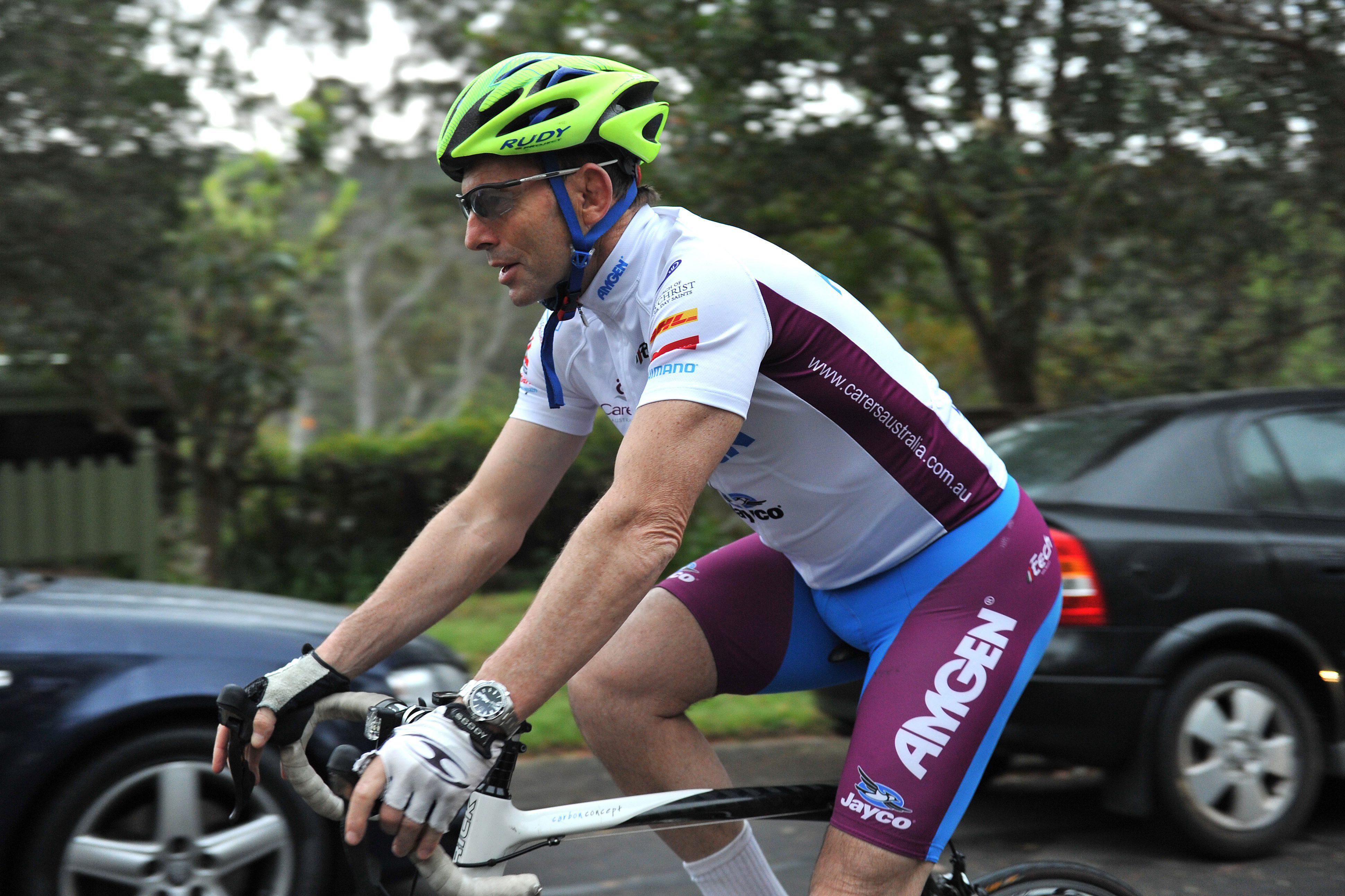 Australian political leader Tony Abbott riding a bicycle