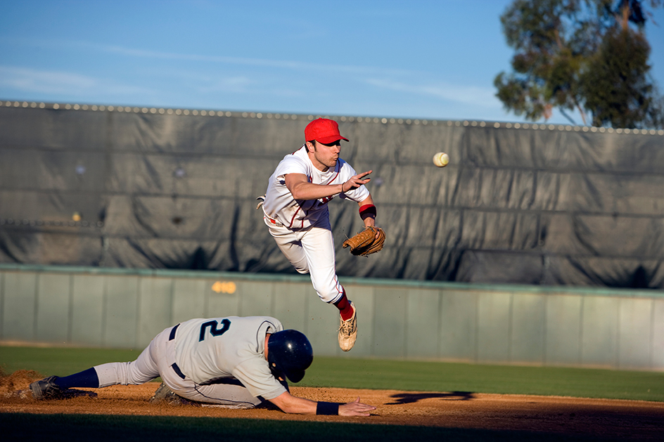 Second baseman throwing to first base