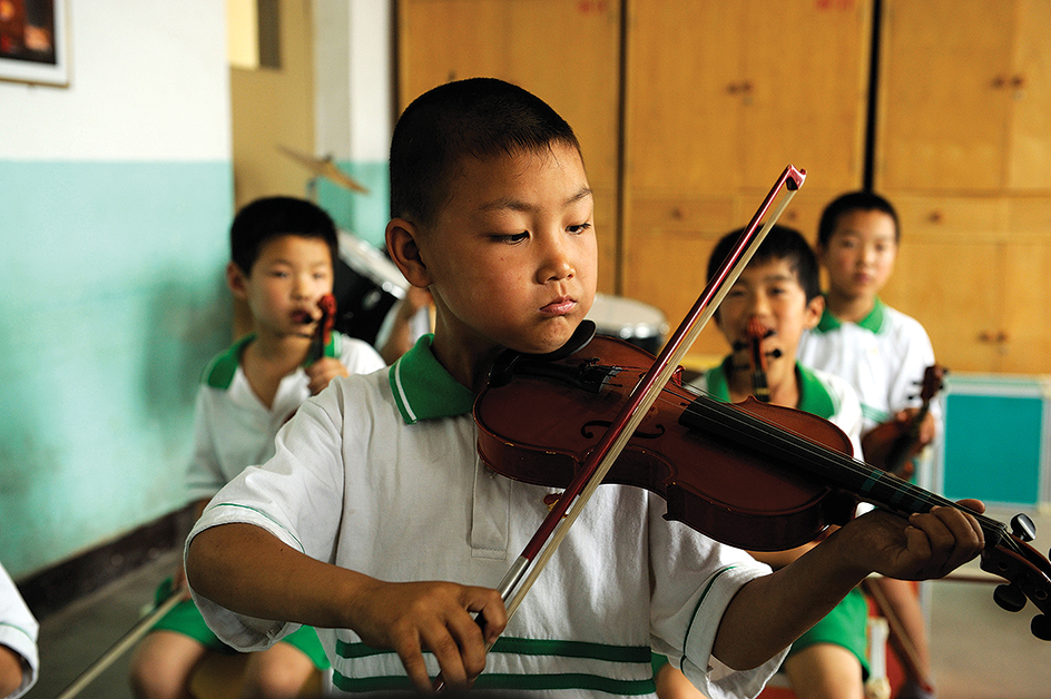 Children practicing violin