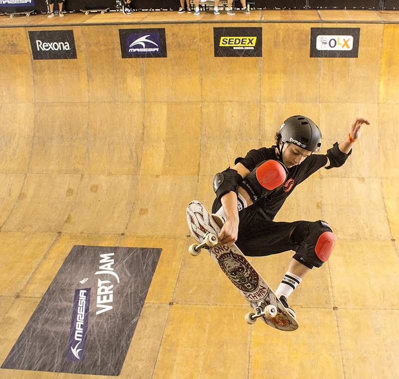 Professional skateboarder performs an aerial maneuver