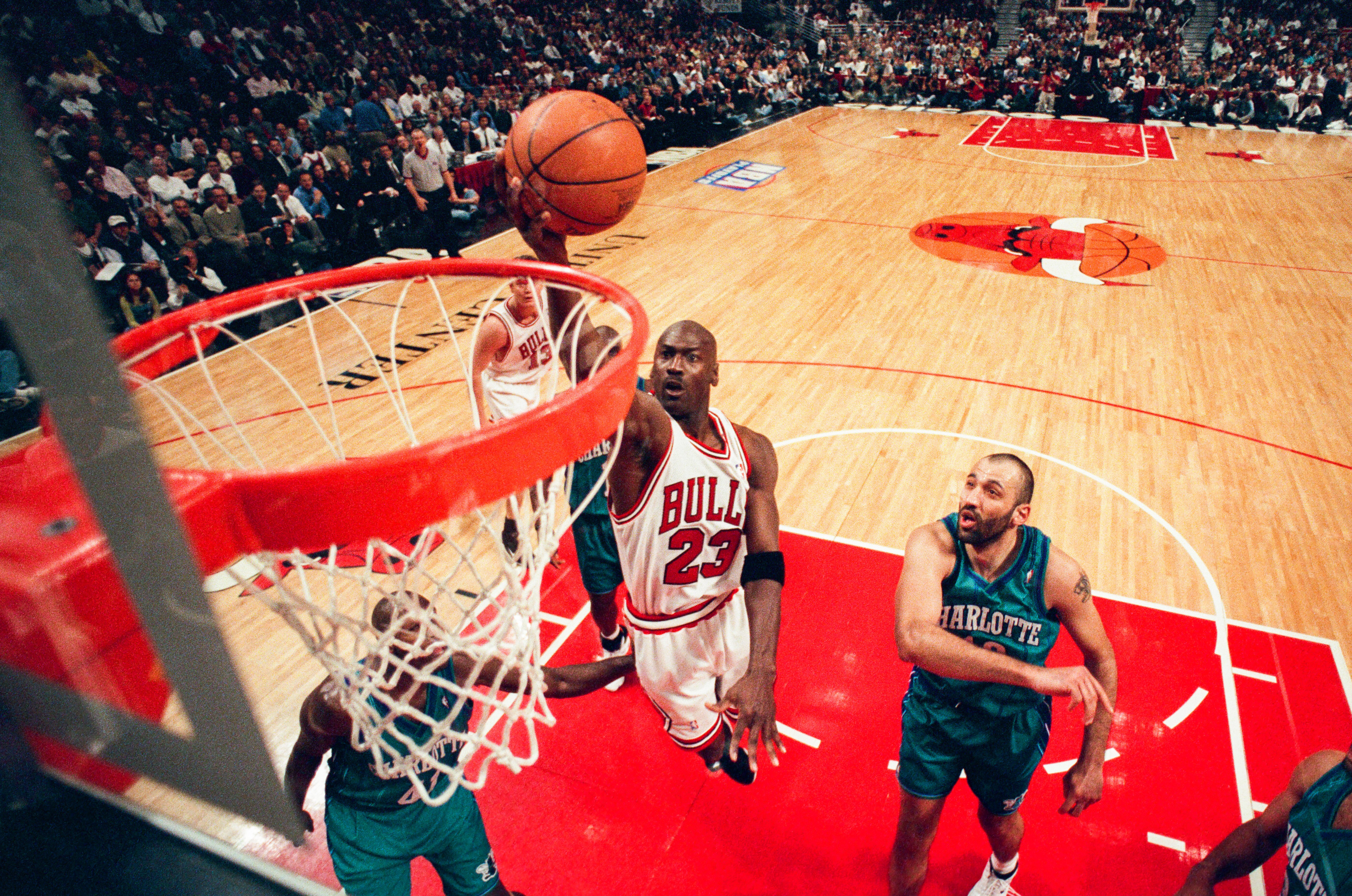 Basketball star Michael Jordan scoring a basket