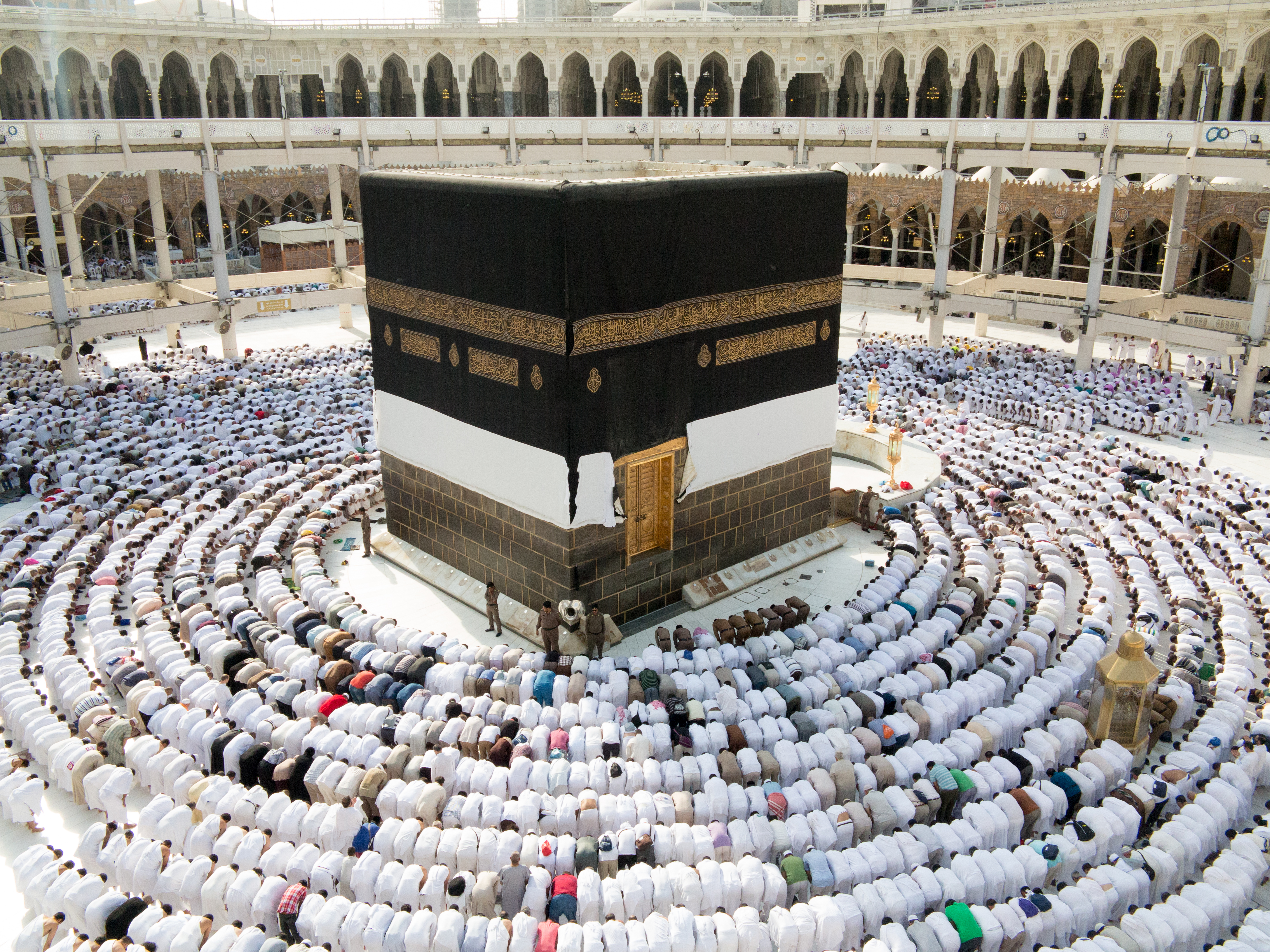 Pilgrims praying at the Ka`ba