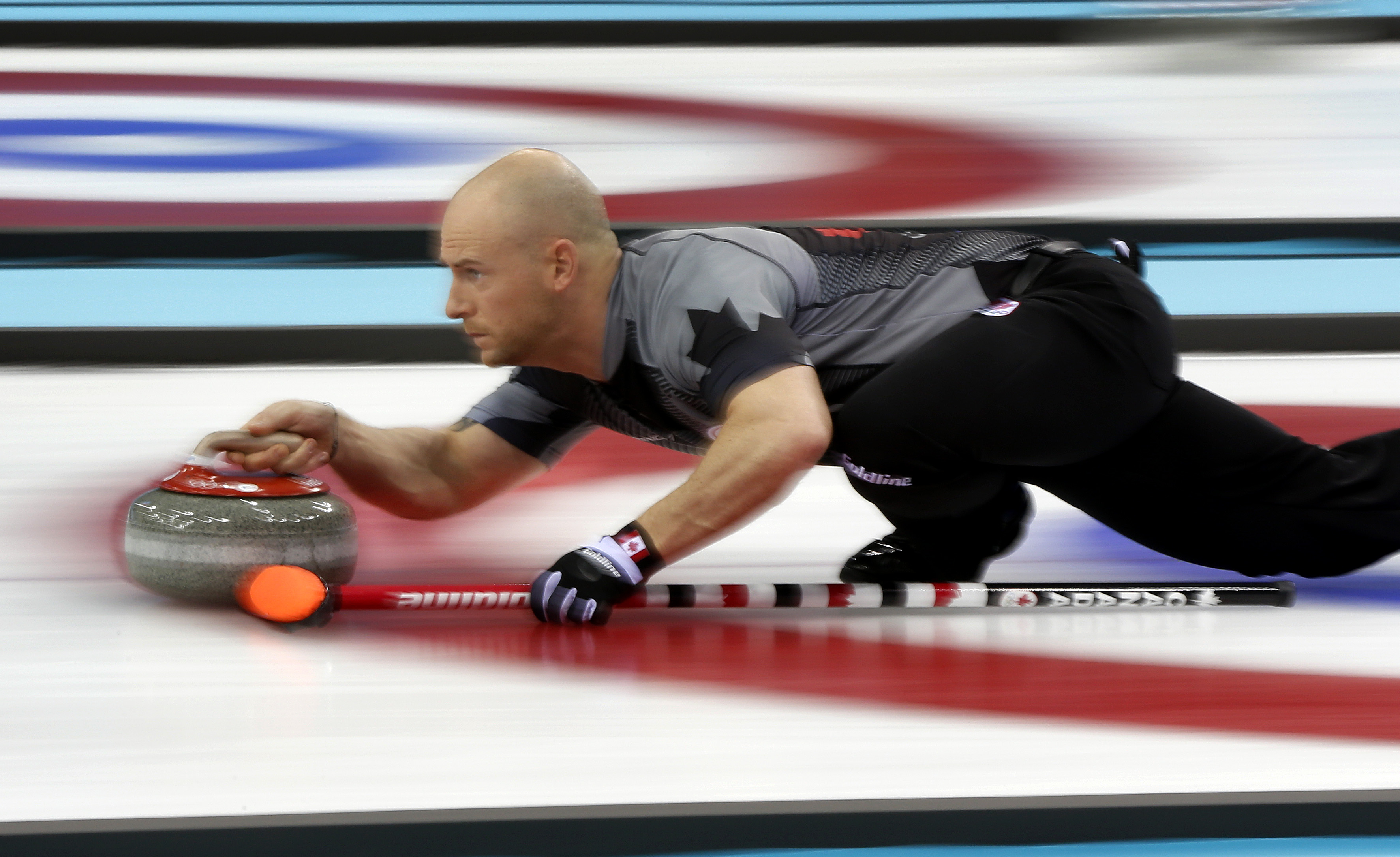 Canadian curler Ryan Fry delivering the stone