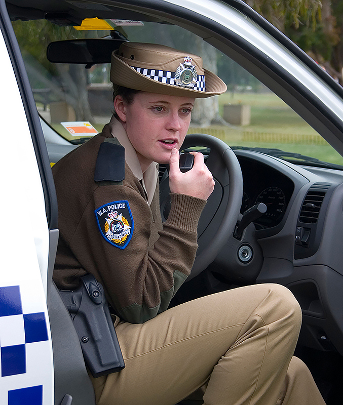 Australian patrol officer uses a two-way radio