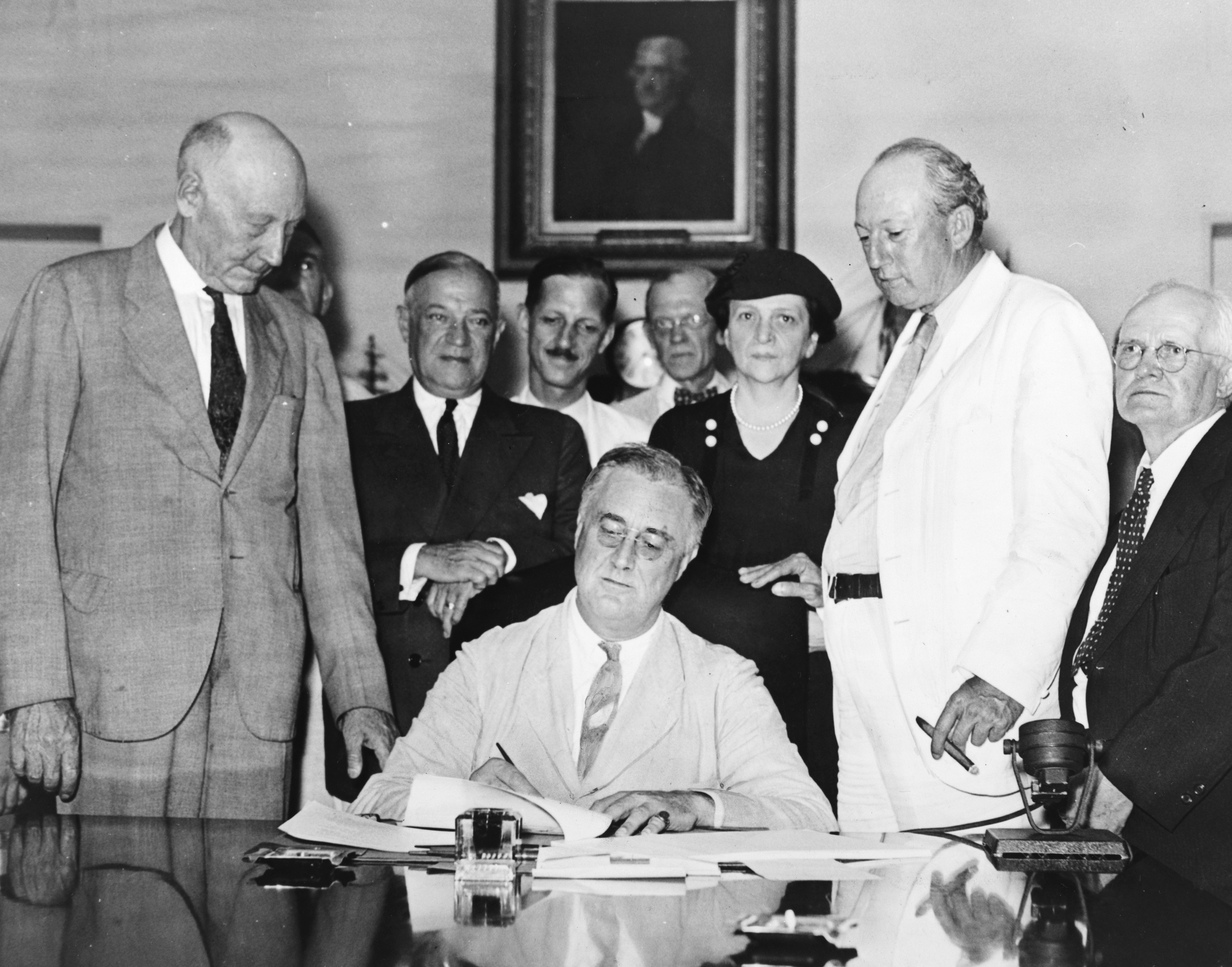 President Franklin D. Roosevelt signing the Social Security Act in 1935