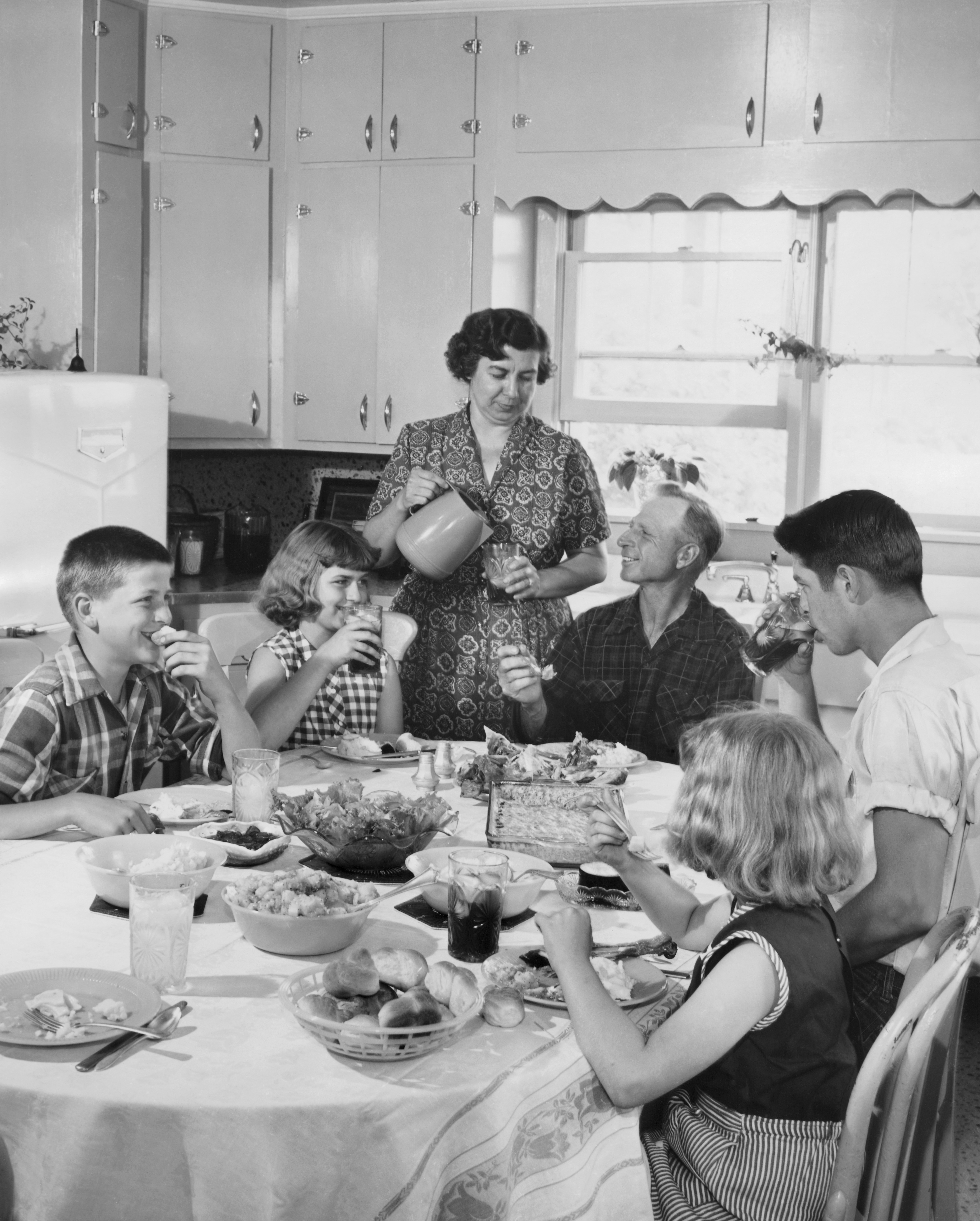 American family of the 1950's sharing a meal