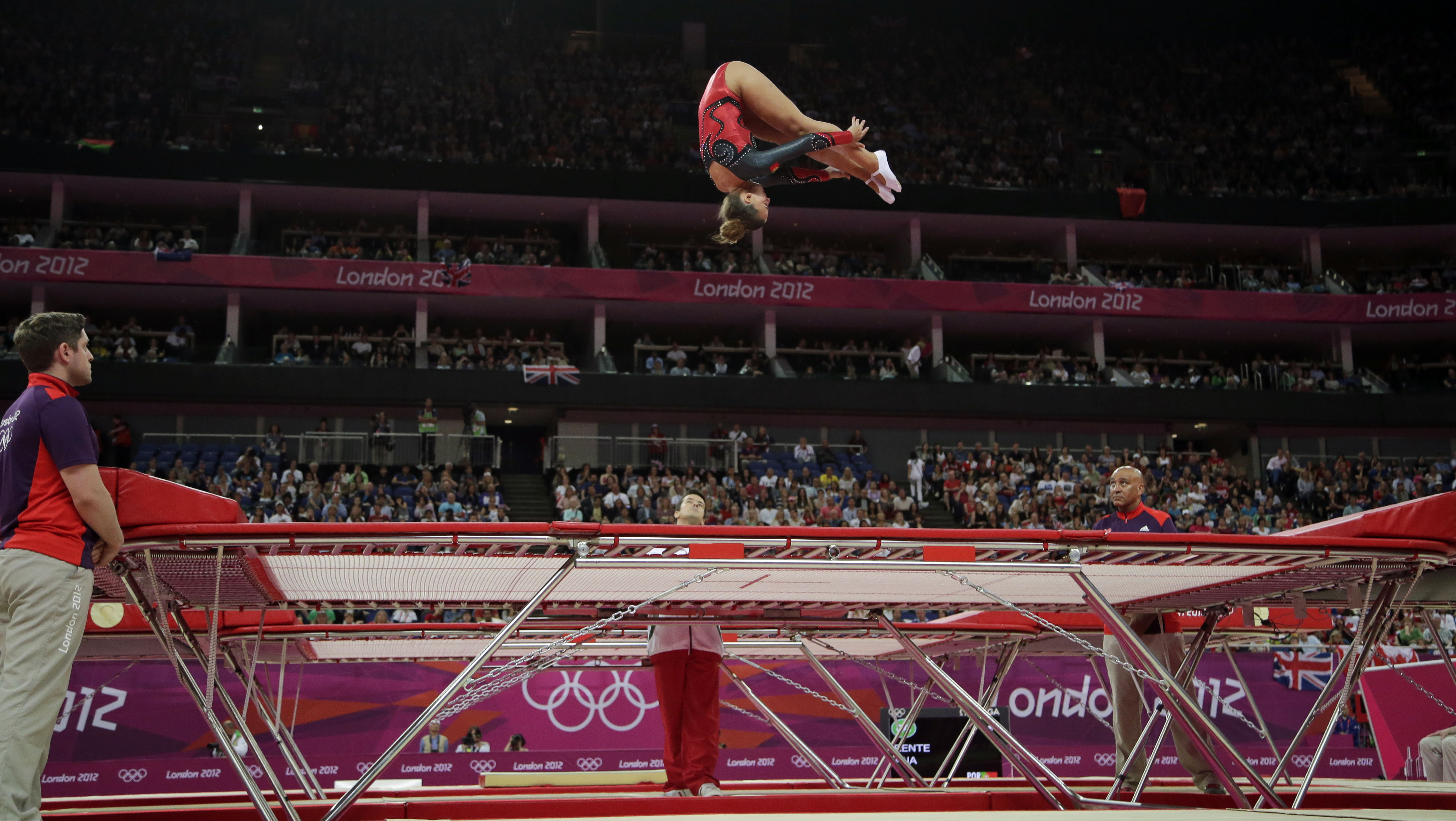 A gymnast performs on the trampoline