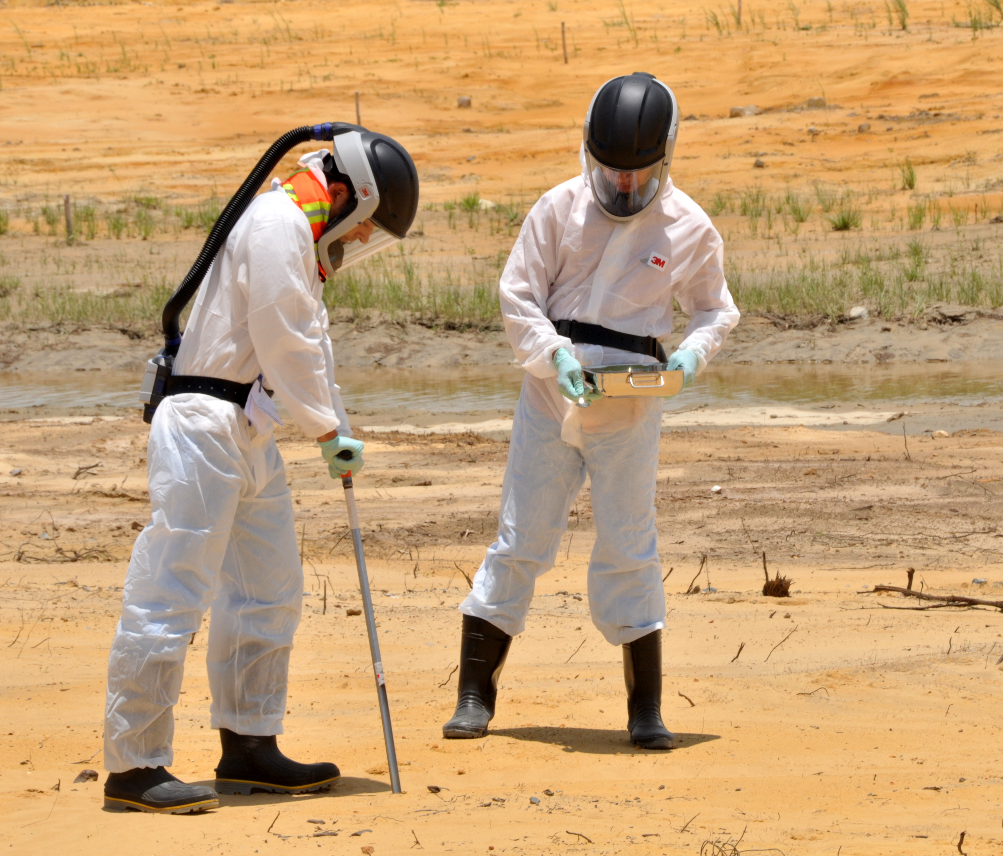 Environmental geologists testing soil