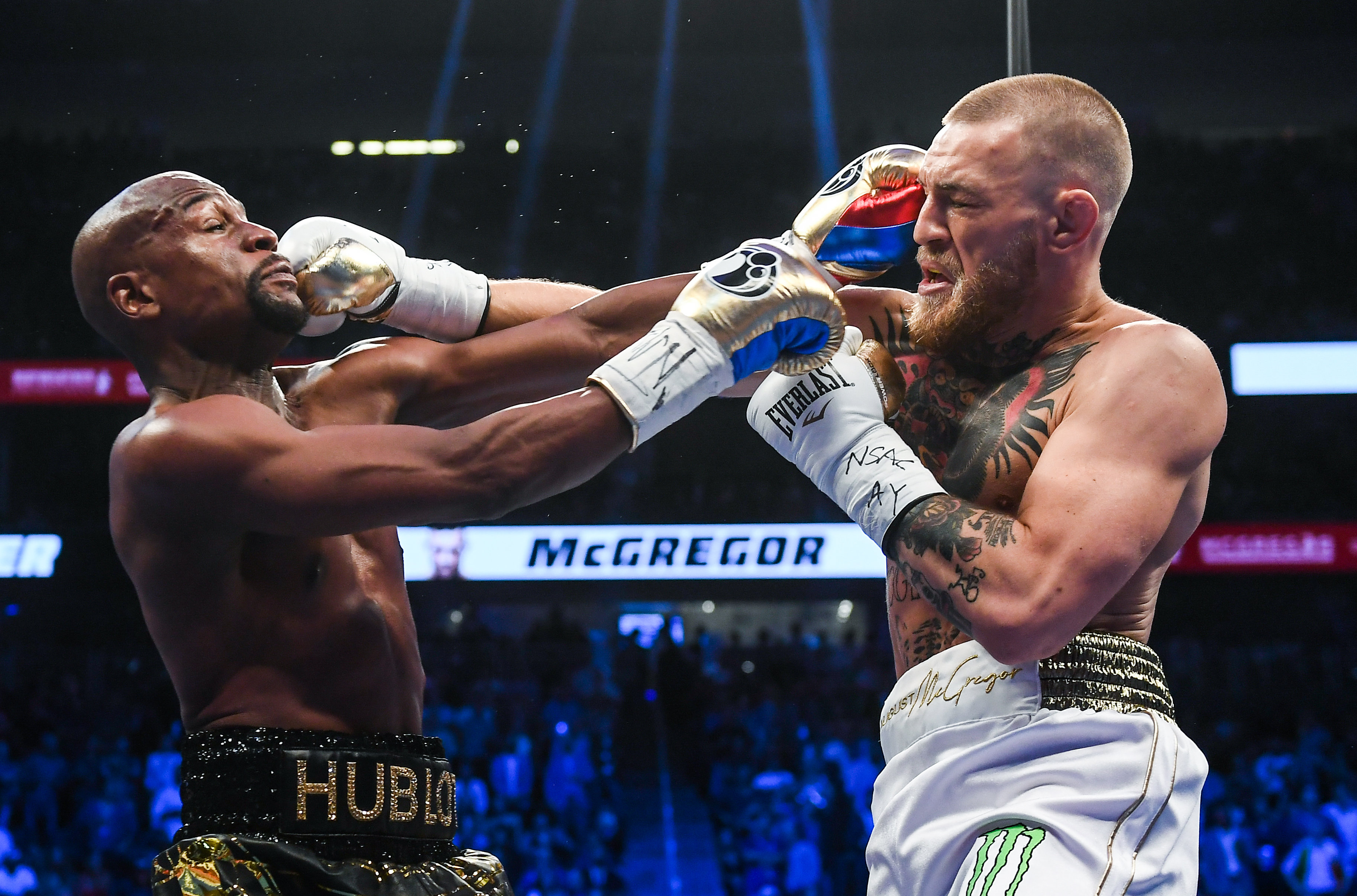 American boxer Floyd Mayweather, Jr. (left) and Irish mixed martial artist Conor McGregor (right)