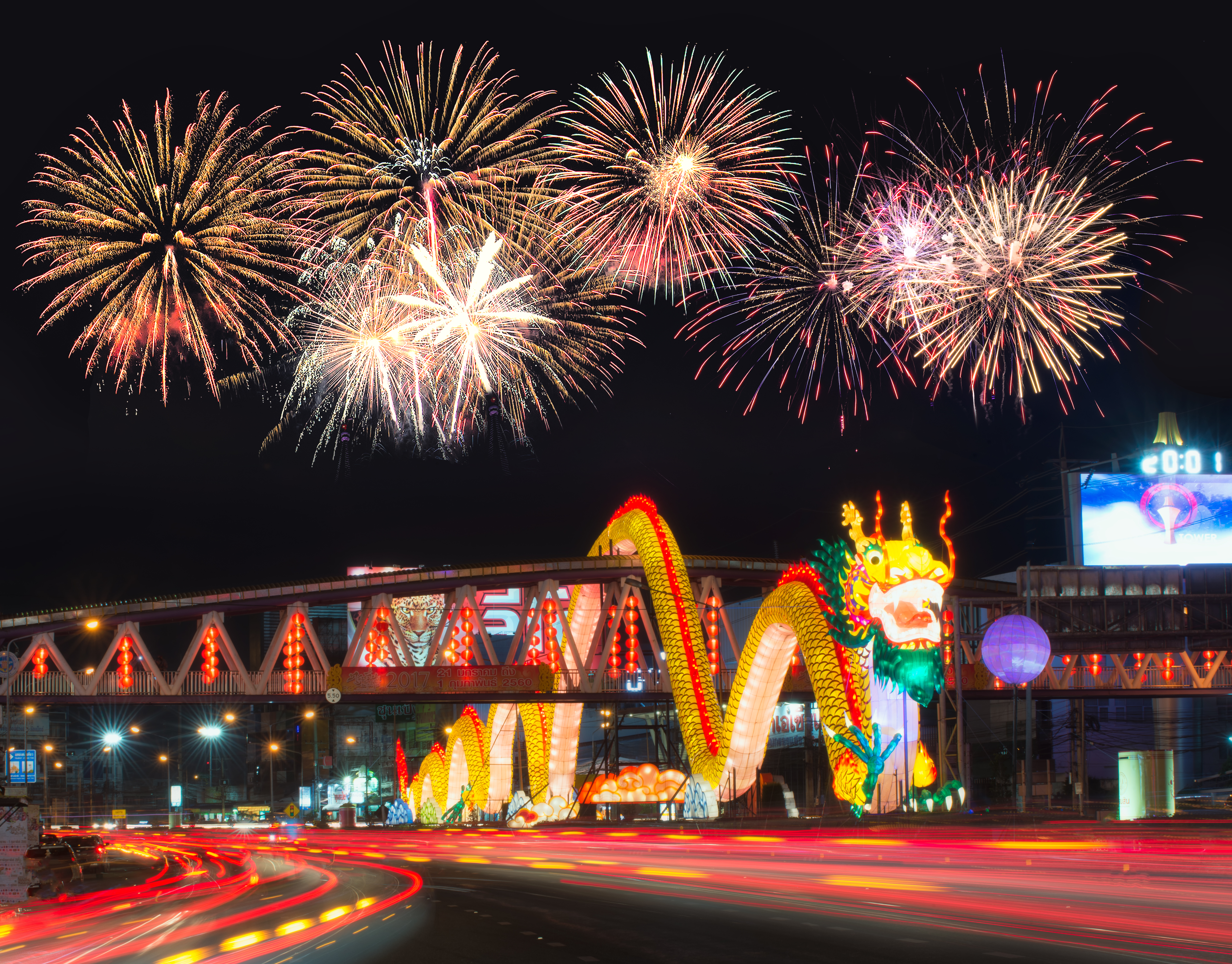 A glowing dragon adorns a bridge in Thailand 