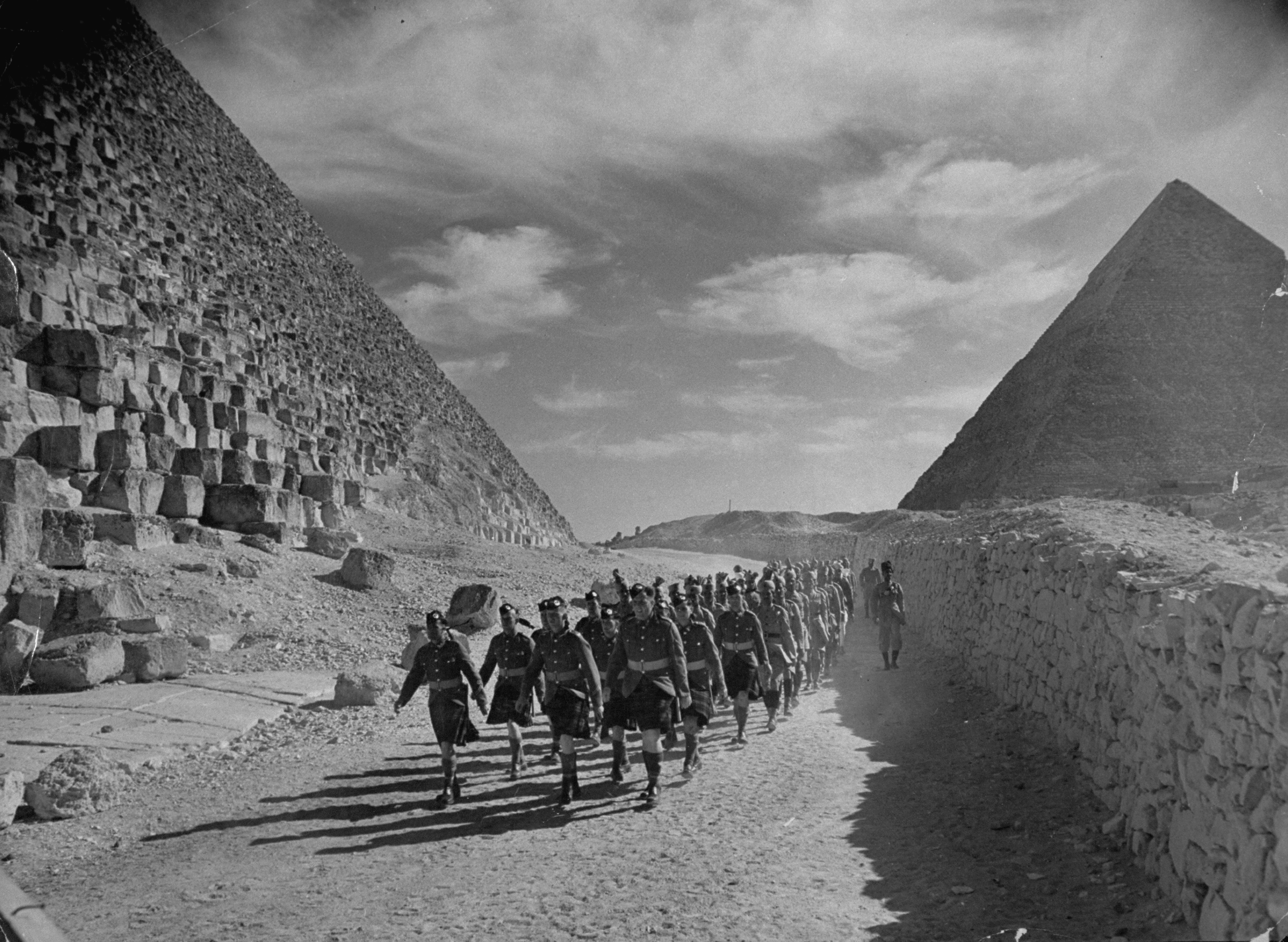 British and Commonwealth troops march past Egypt's pyramids